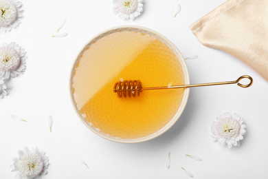 Flat lay composition with organic honey on white background