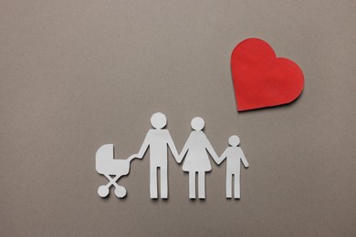 Photo of Paper family figures and red heart on light grey background, flat lay. Insurance concept