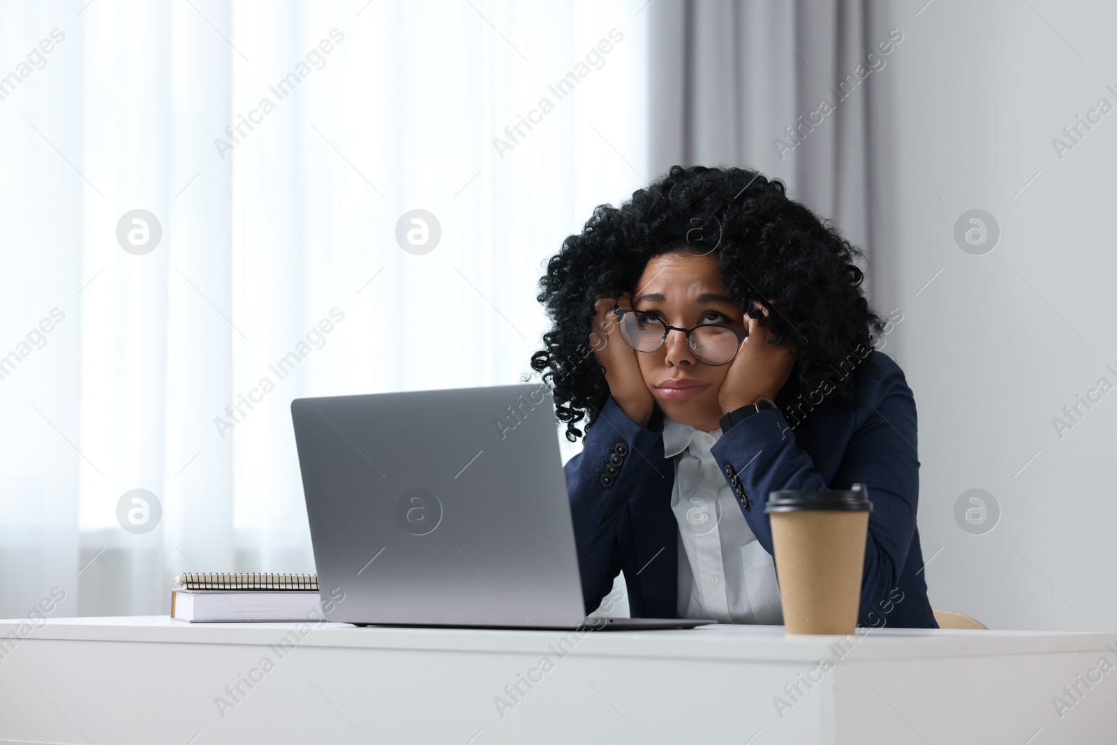 Photo of Deadline concept. Stressed woman sitting near laptop in office. Space for text