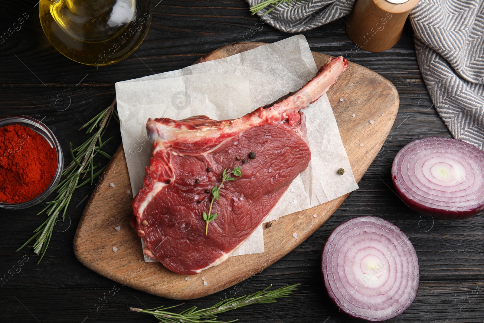 Photo of Flat lay composition with fresh beef cut on wooden table