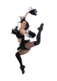 Beautiful cheerleader in costume jumping on white background