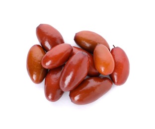 Heap of ripe red dates on white background, top view