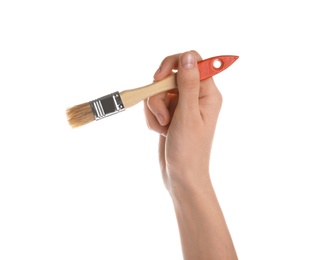 Woman holding paint brush on white background, closeup