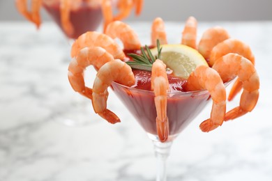 Photo of Delicious shrimp cocktail with tomato sauce, closeup