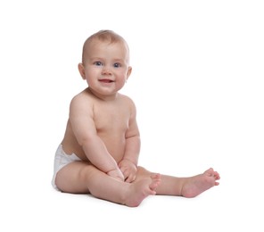 Photo of Cute baby in dry soft diaper sitting on white background