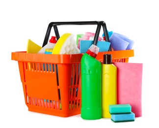 Photo of Shopping basket full of detergents on white background