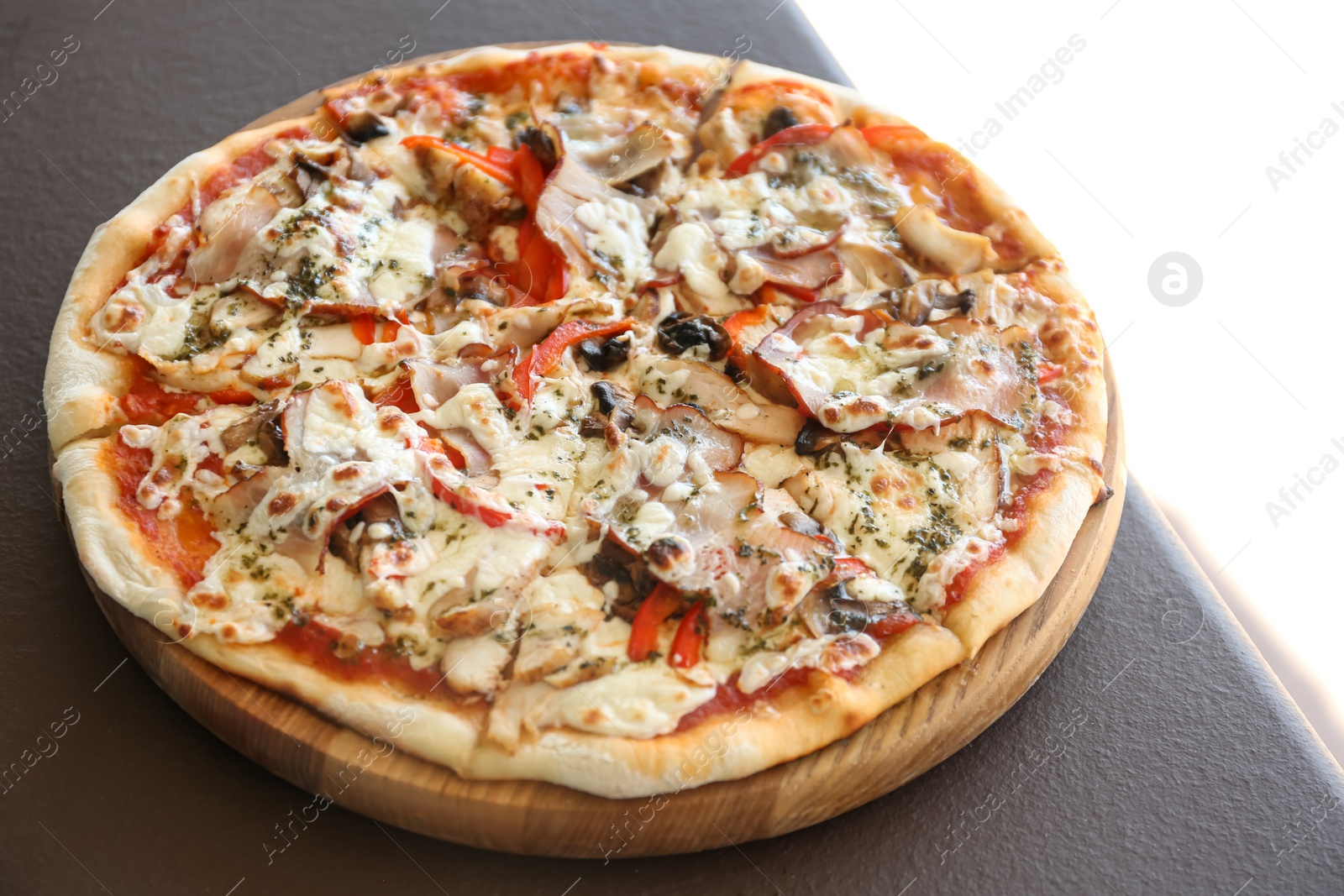 Photo of Delicious fresh pizza with olives on table outdoors