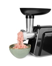 Electric meat grinder with chicken mince and bowl isolated on white