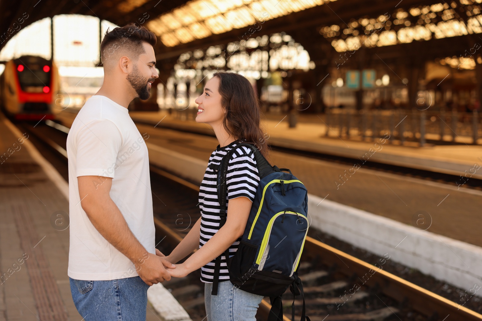 Photo of Long-distance relationship. Beautiful couple on platform of railway station