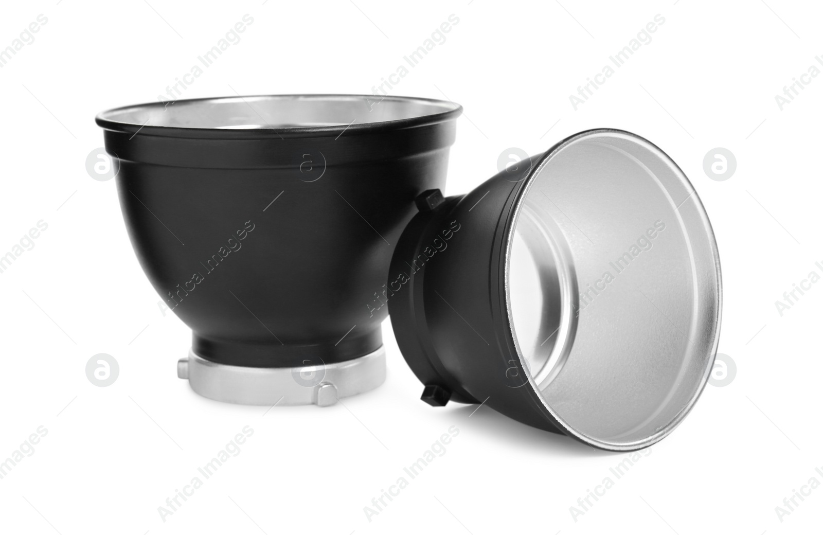 Photo of Studio flash lights reflectors on white background. Professional photographer's equipment