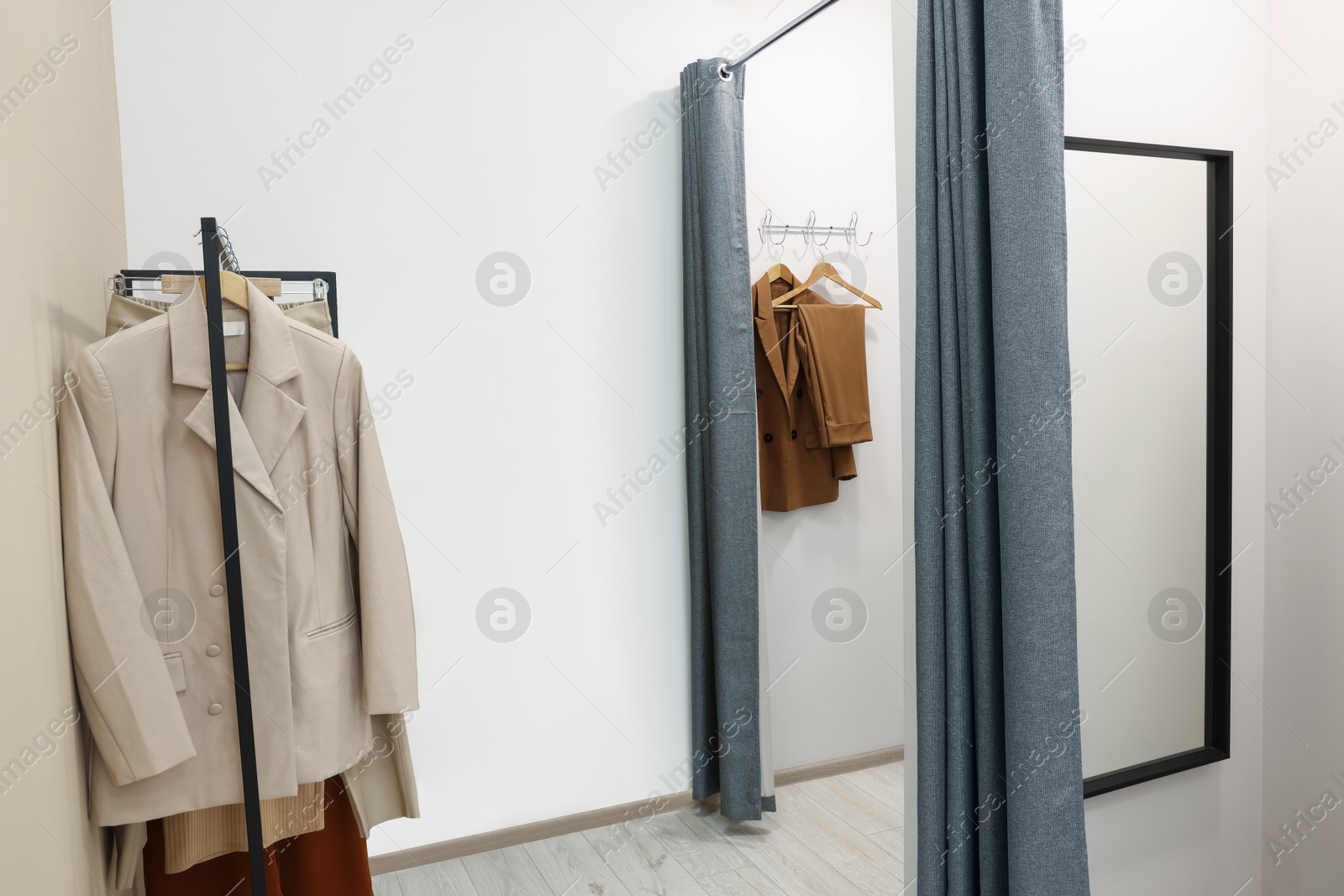 Photo of Dressing rooms in fashion store. Interior design