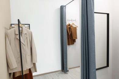 Photo of Dressing rooms in fashion store. Interior design