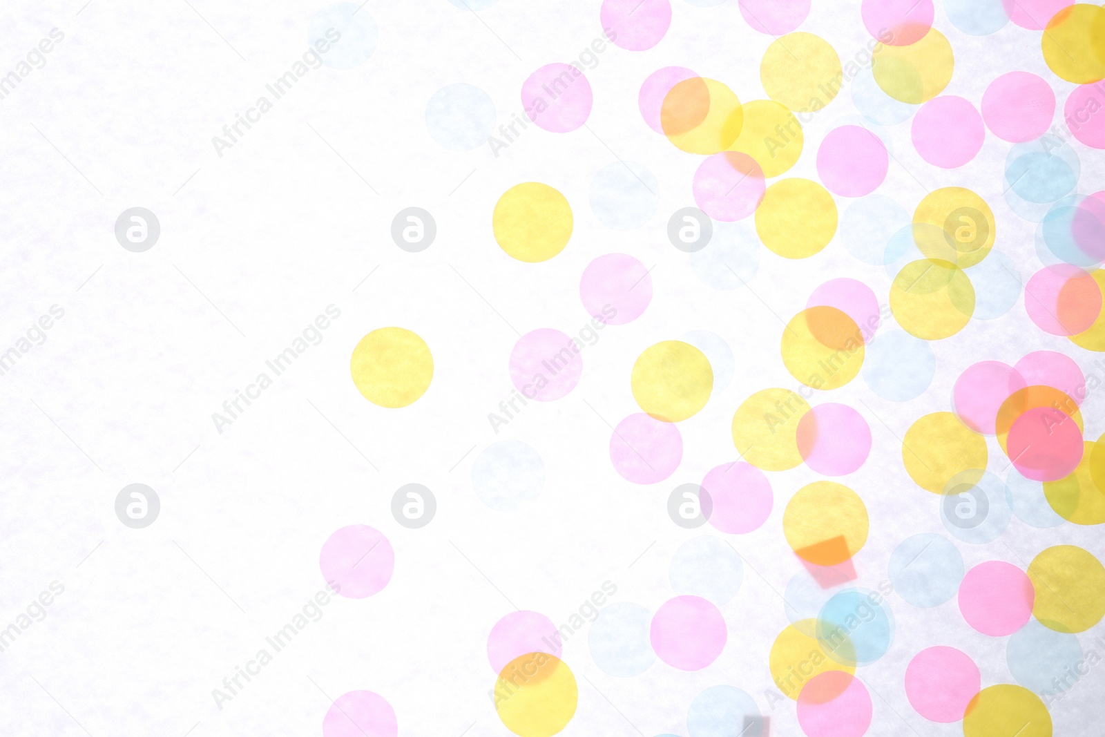 Photo of Colorful confetti on white background, top view