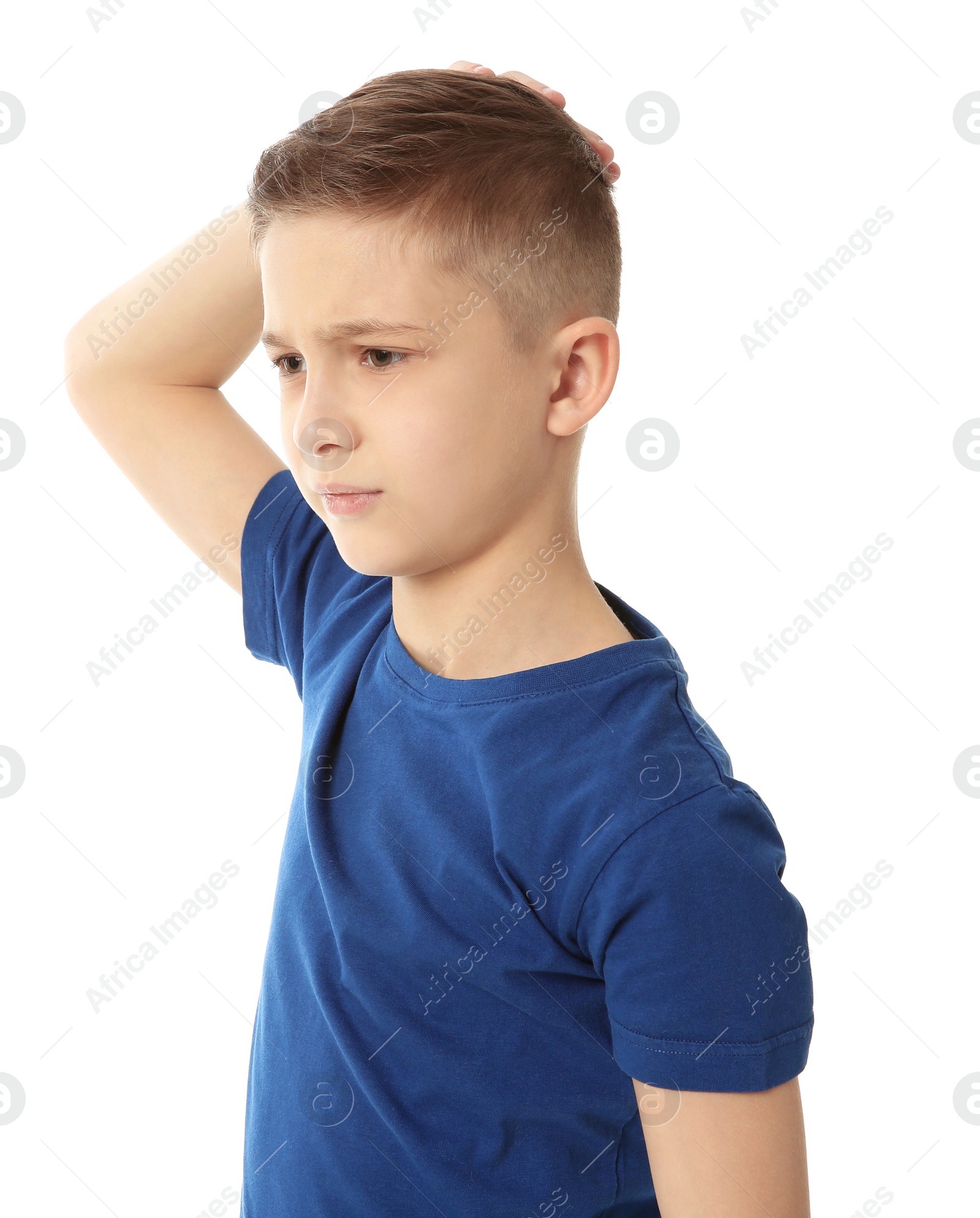 Photo of Little boy suffering from headache on white background