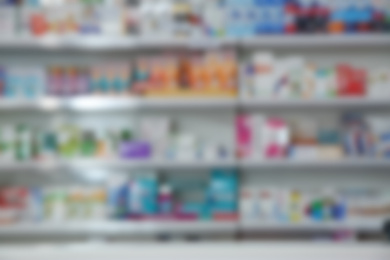 Image of Blurred view of modern pharmacy interior with different medicine