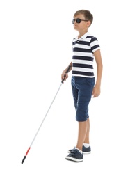 Blind boy with long cane walking on white background