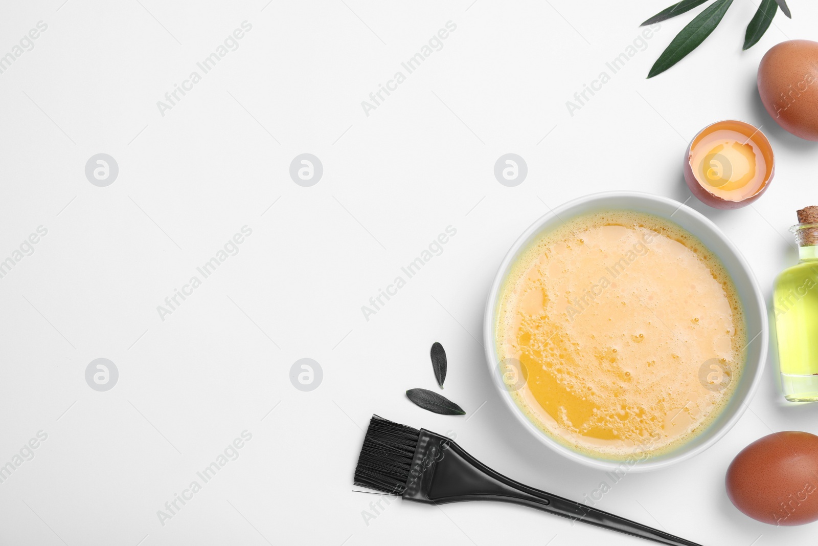 Photo of Homemade hair mask, brush and ingredients on white background, flat lay. Space for text