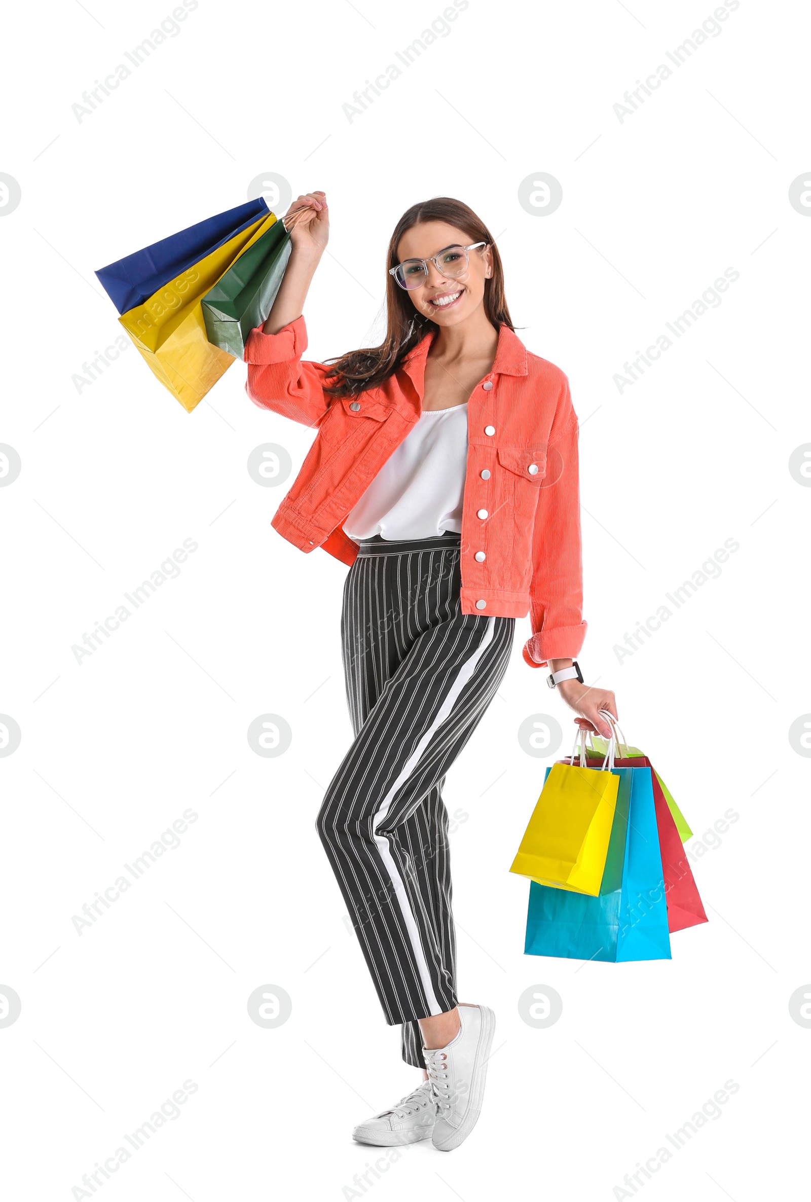 Photo of Young woman with shopping bags on white background