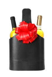 Photo of Wine bottles in festive package with red bow isolated on white