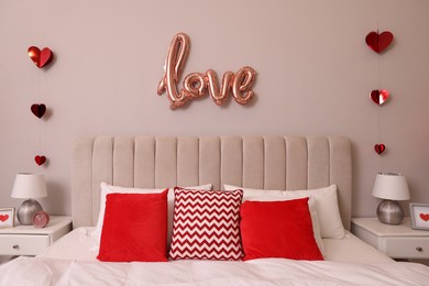 Photo of Cozy bedroom decorated for Valentine Day. Interior design