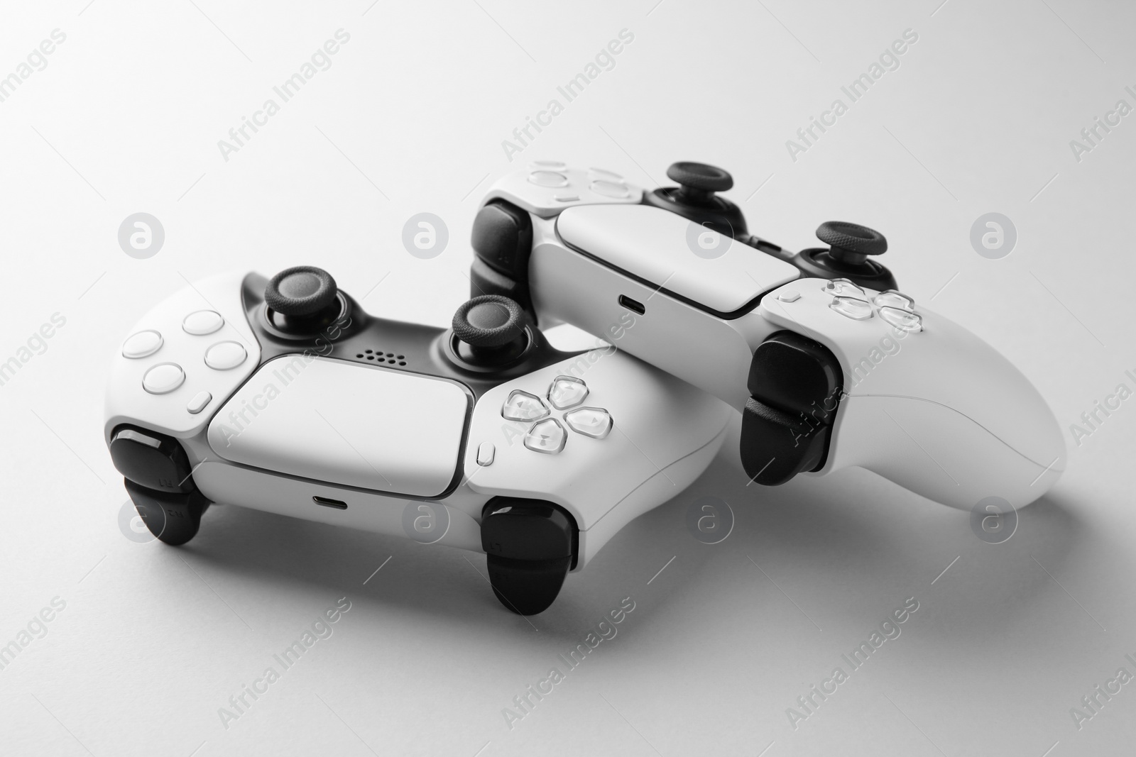 Photo of Wireless game controllers on light grey background