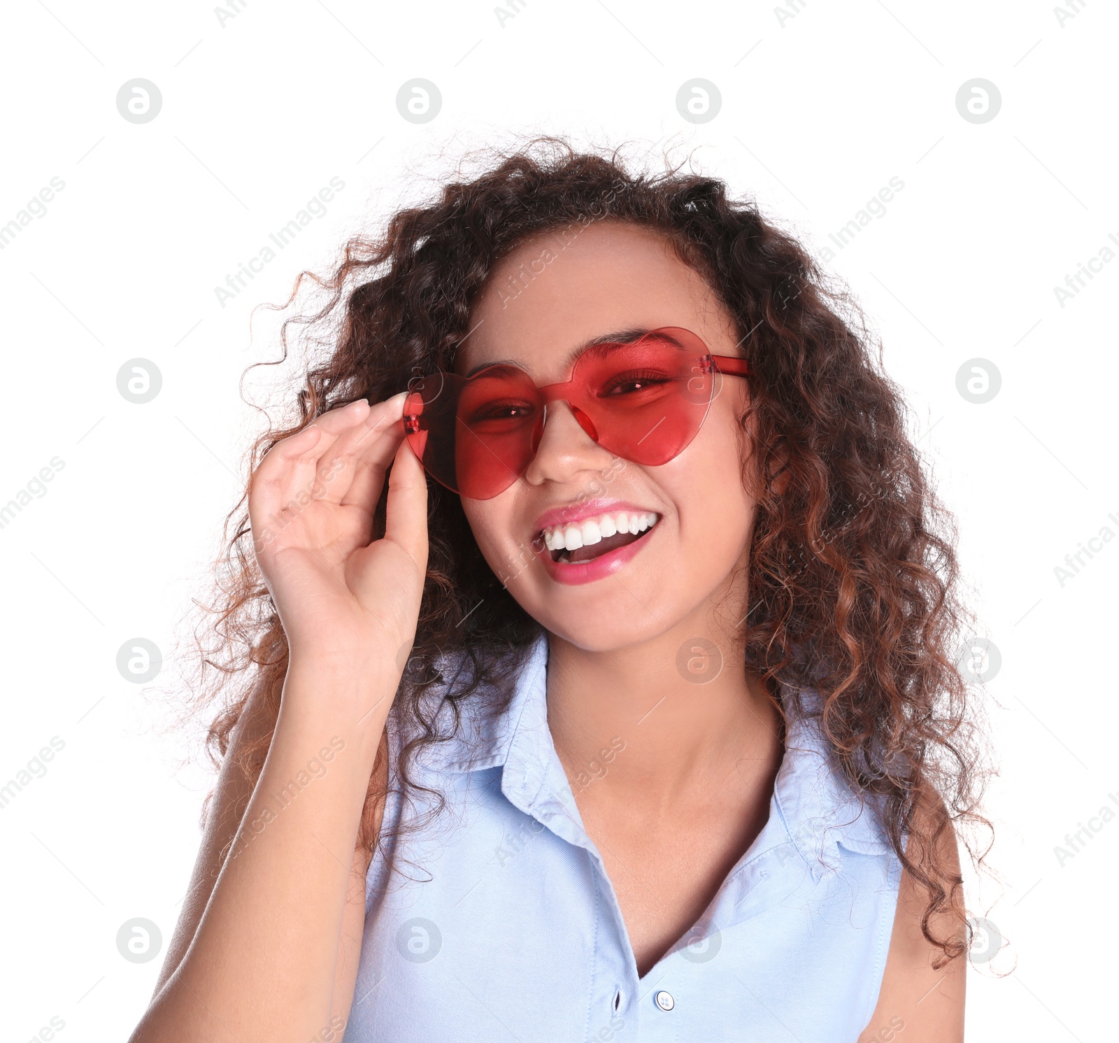 Photo of Young beautiful African-American woman wearing heart shaped glasses on white background