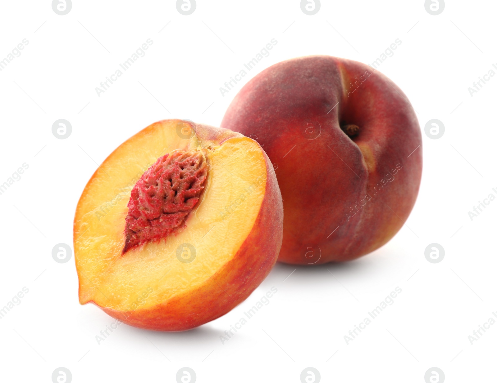 Photo of Whole and cut ripe peaches isolated on white