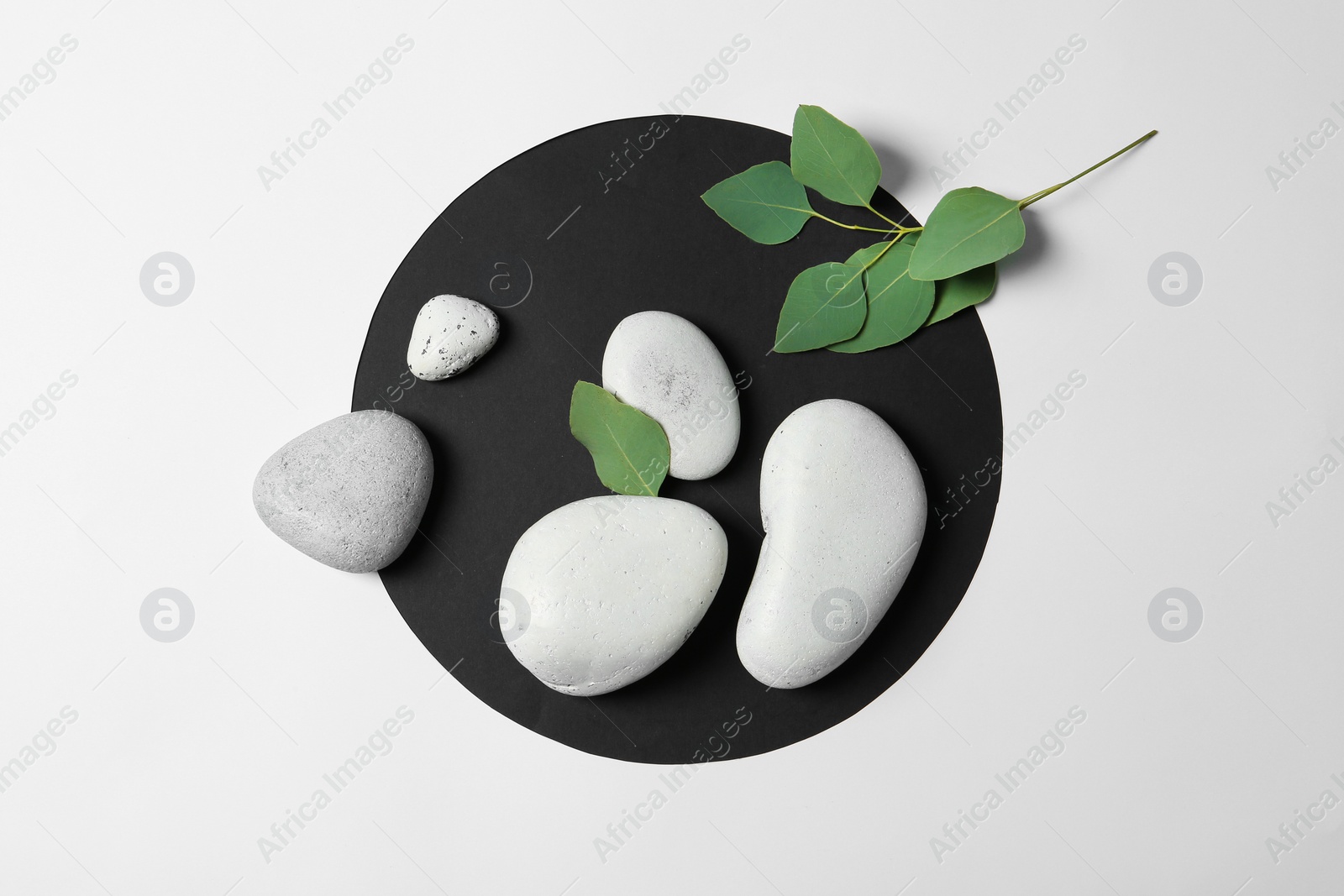 Photo of Flat lay composition with spa stones on white background