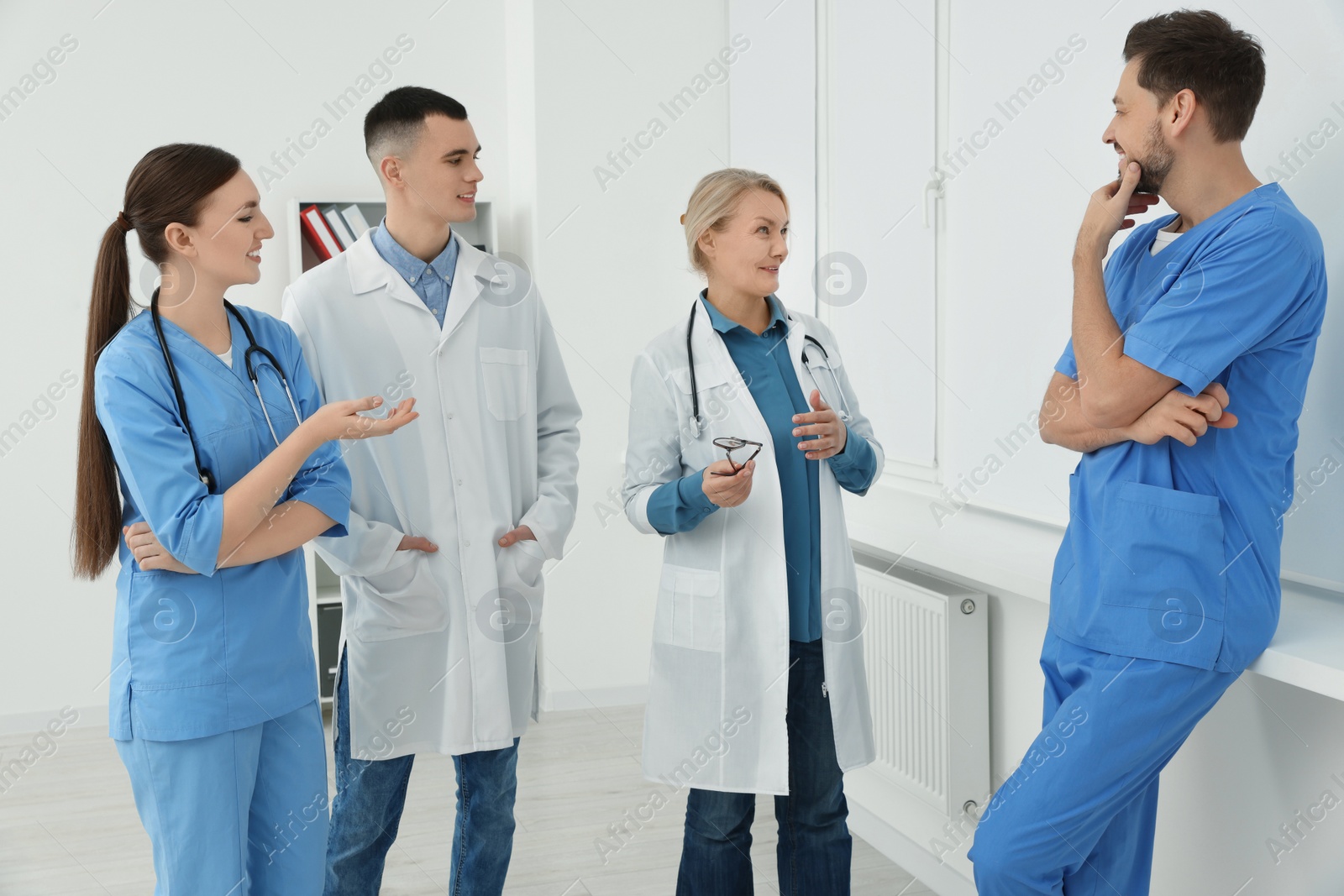 Photo of Team of doctors having discussion in clinic