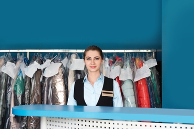 Portrait of young female worker in dry-cleaning