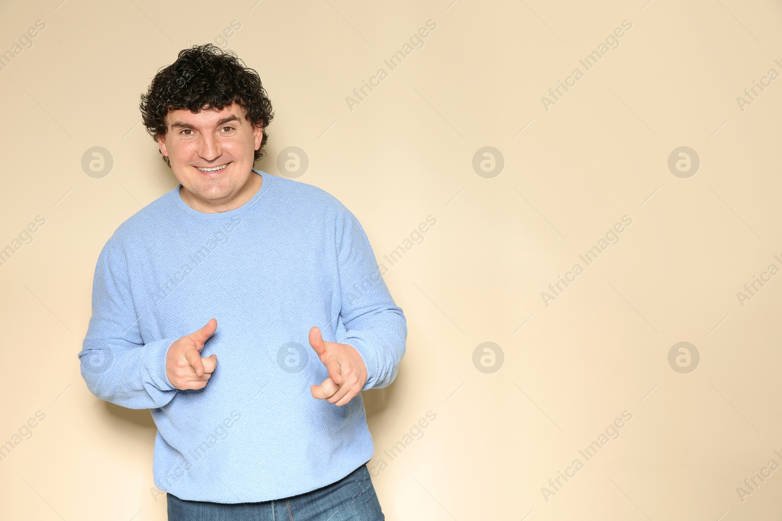 Photo of Portrait of handsome mature man posing on color background. Space for text