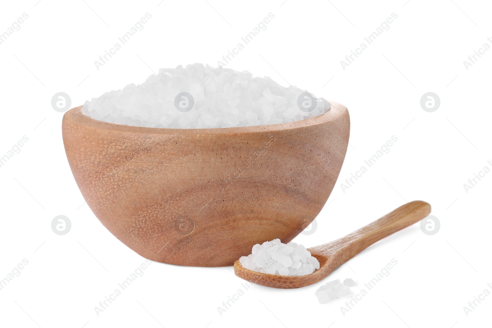 Photo of Wooden bowl and spoon with natural sea salt isolated on white