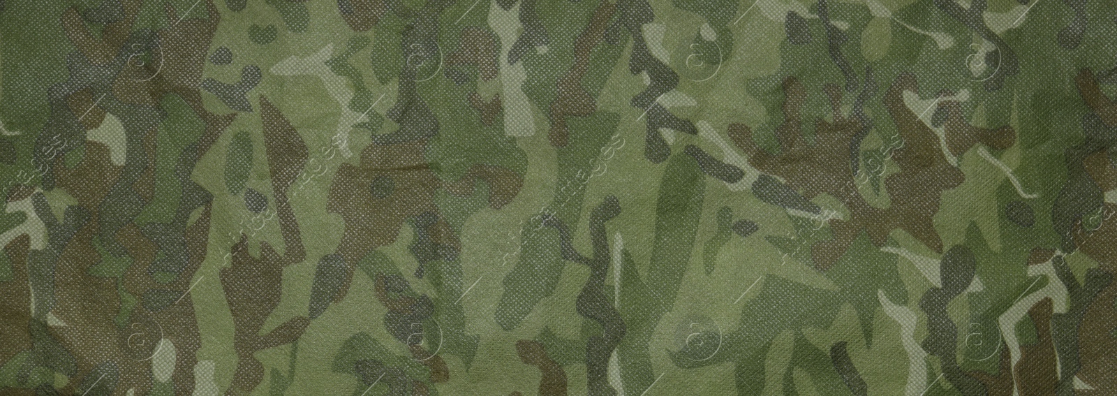 Photo of Texture of camouflage fabric as background, top view