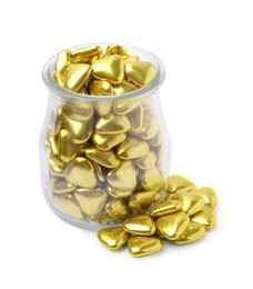 Photo of Glass jar and delicious heart shaped candies on white background