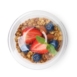 Photo of Tasty granola with berries, nuts and yogurt in plastic cup isolated on white, top view