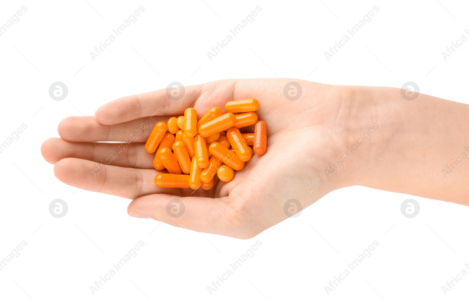 Photo of Woman holding color pills on white background, closeup