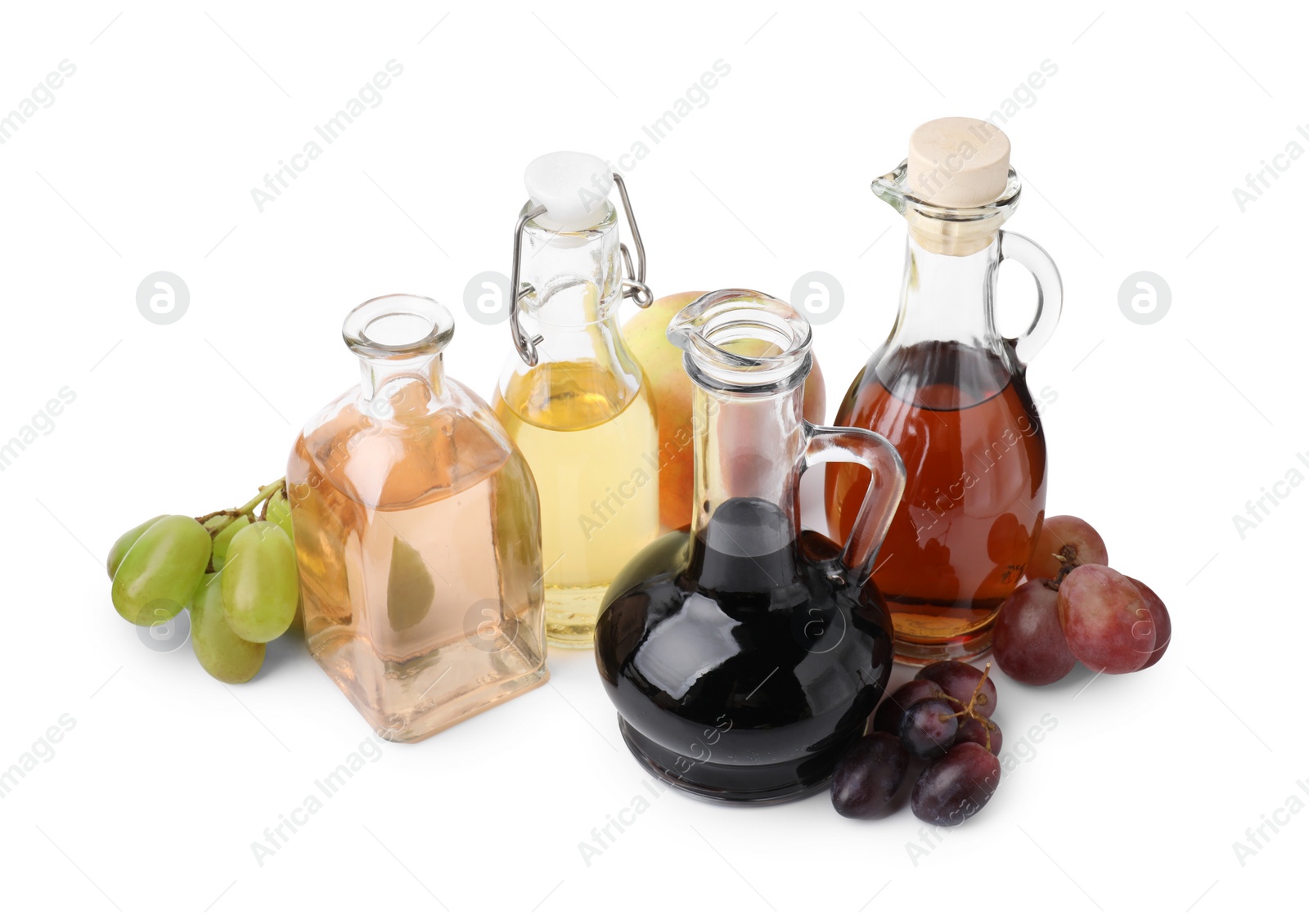 Photo of Different types of vinegar and ingredients isolated on white