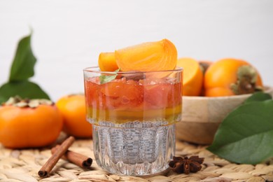 Photo of Delicious dessert with persimmon and chia seeds on table