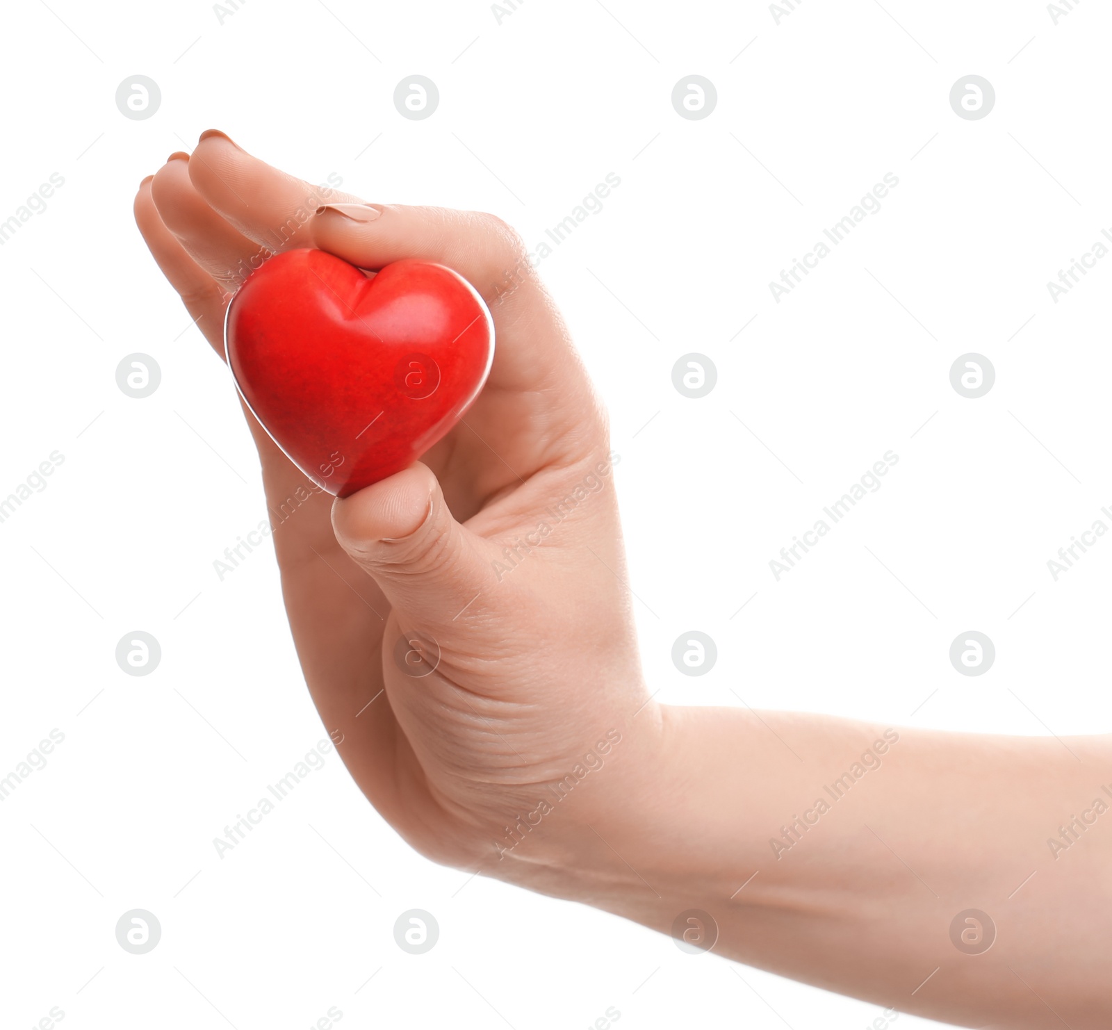 Photo of Woman holding small red heart on white background. Heart attack concept