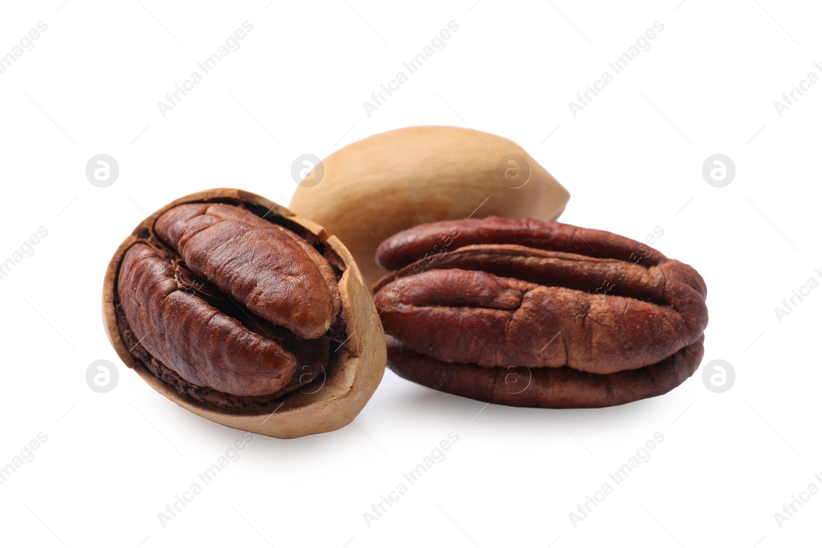 Photo of Many tasty pecan nuts isolated on white