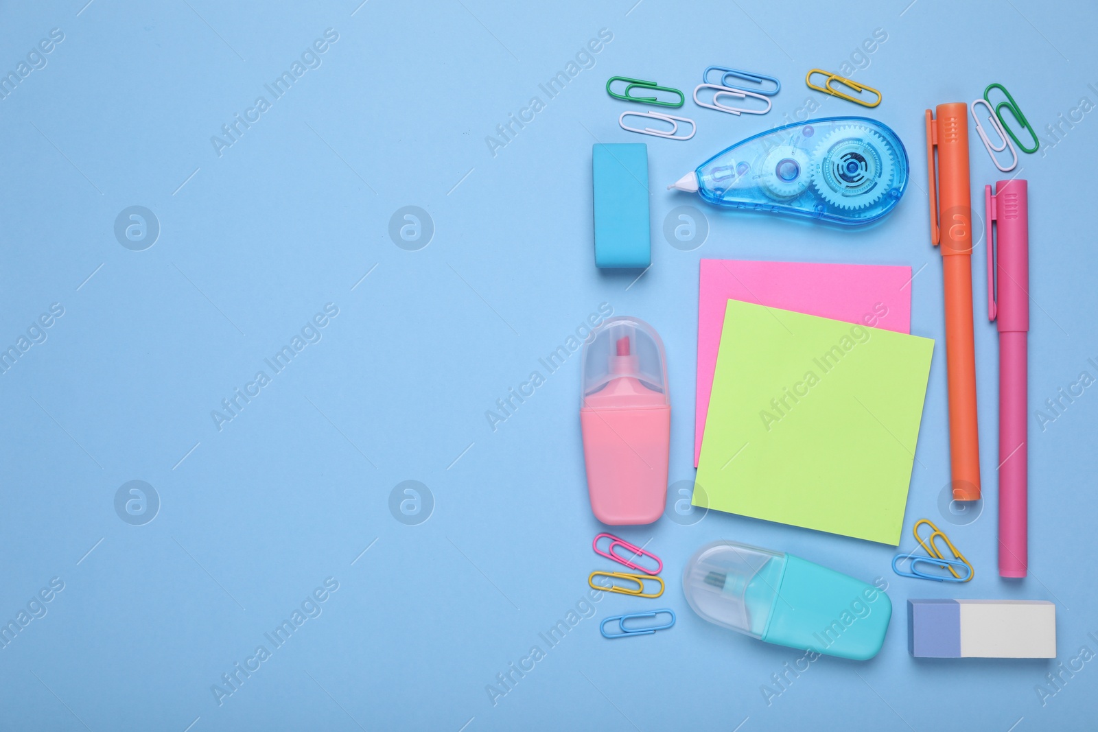 Photo of Flat lay composition with different school stationery on light blue background, space for text. Back to school