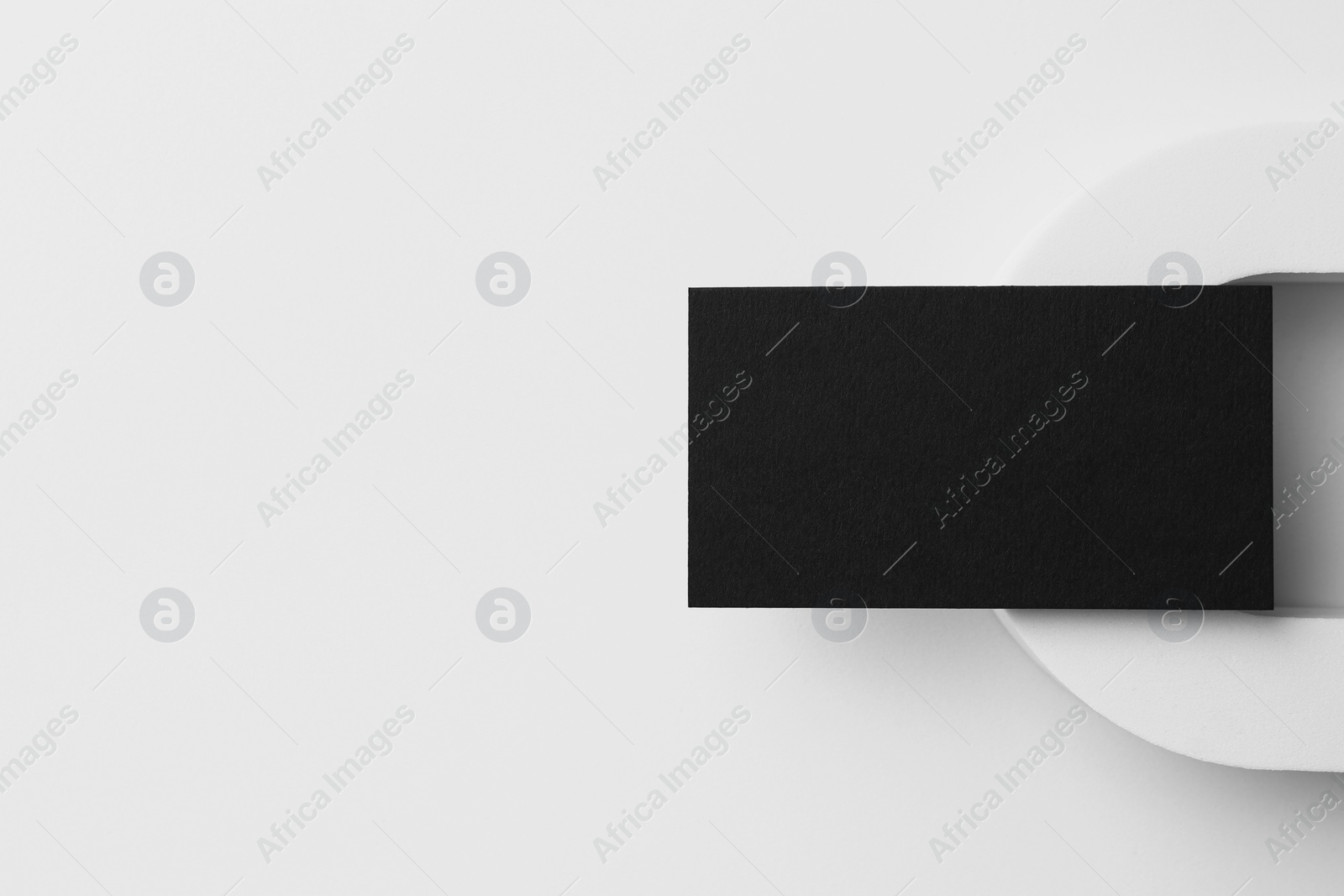 Photo of Blank black business card on white background, top view. Mockup for design