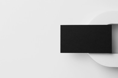 Blank black business card on white background, top view. Mockup for design