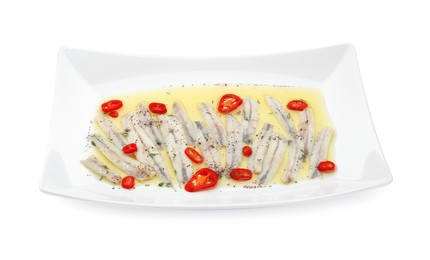 Photo of Tasty pickled anchovies with spices isolated on white