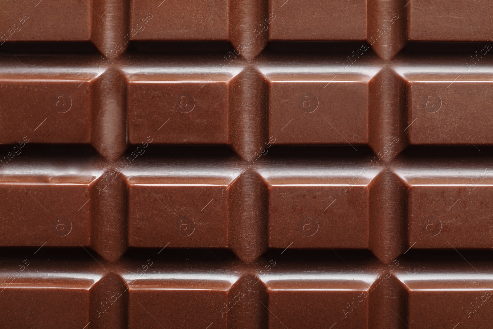 Photo of Tasty dark chocolate bar as background, top view