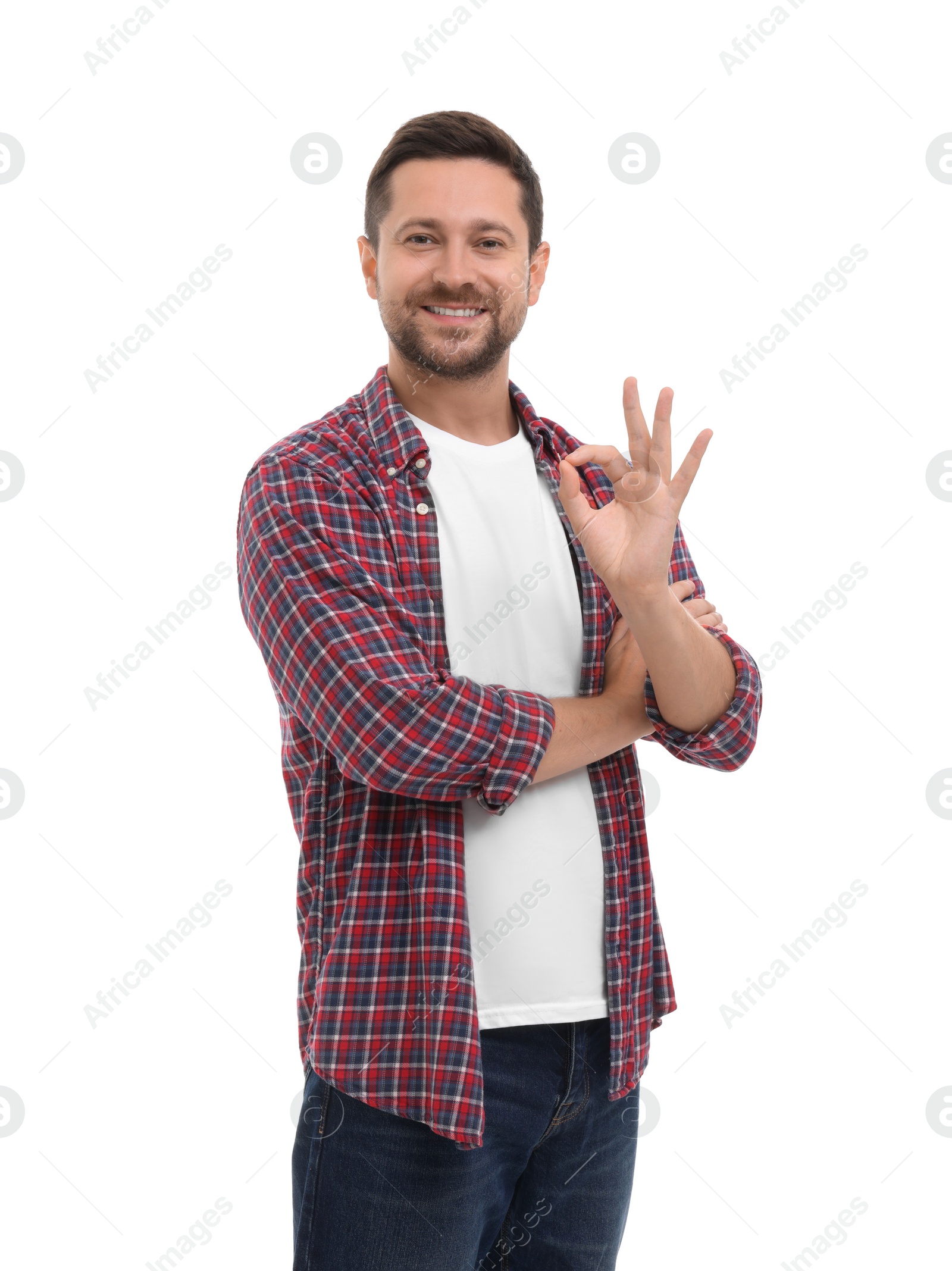 Photo of Happy man showing ok gesture on white background