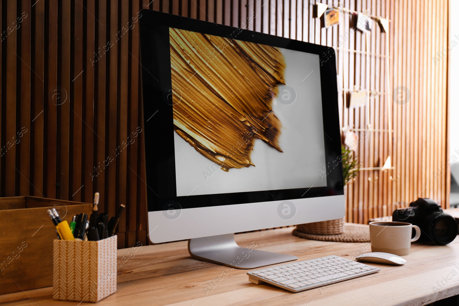 Photo of Modern computer on desk in room. Home workplace