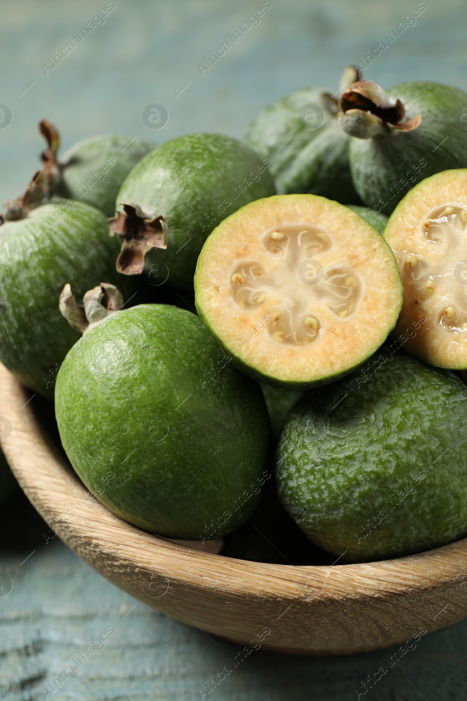 Photo of Fresh green feijoa fruits in bowl, closeup