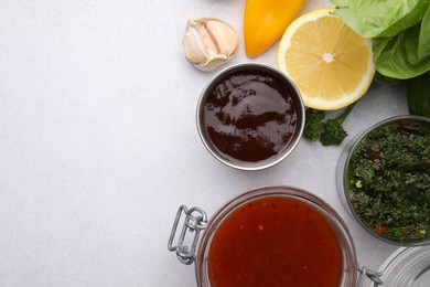 Photo of Different marinades and products on light table, flat lay. Space for text