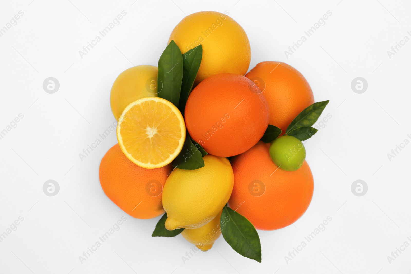 Photo of Different citrus fruits and leaves on white background, top view